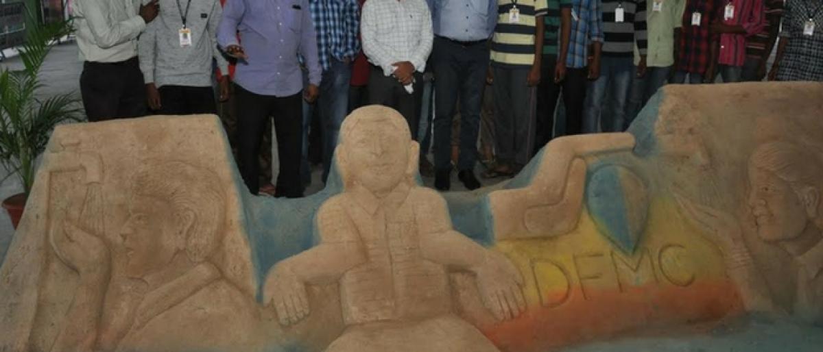 District Collector Gaurav Uppal inspecting a sand sculpture that was installed at an agriculture market warehouse in Nalgonda on Tuesday 