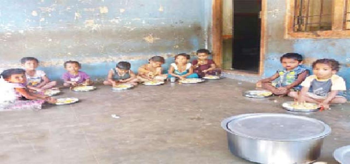 Children eating lunch at an anganwadi centre in Lododdi village in East Godavari