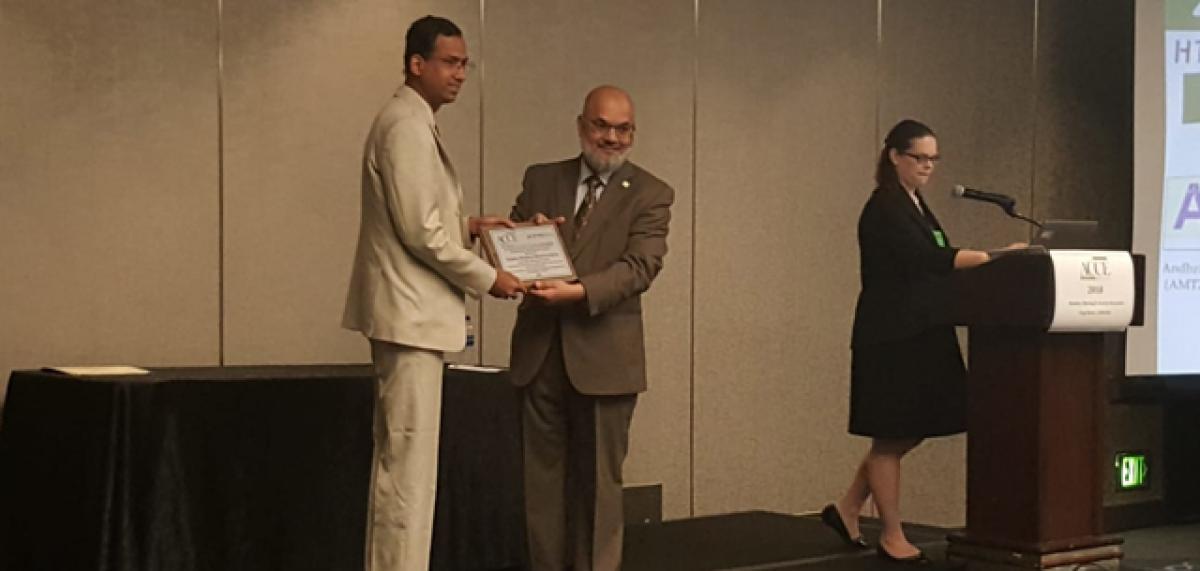 Managing Director and Chief Executive Officer of AMTZ Dr.Jitendra Sharma receiving the award at California