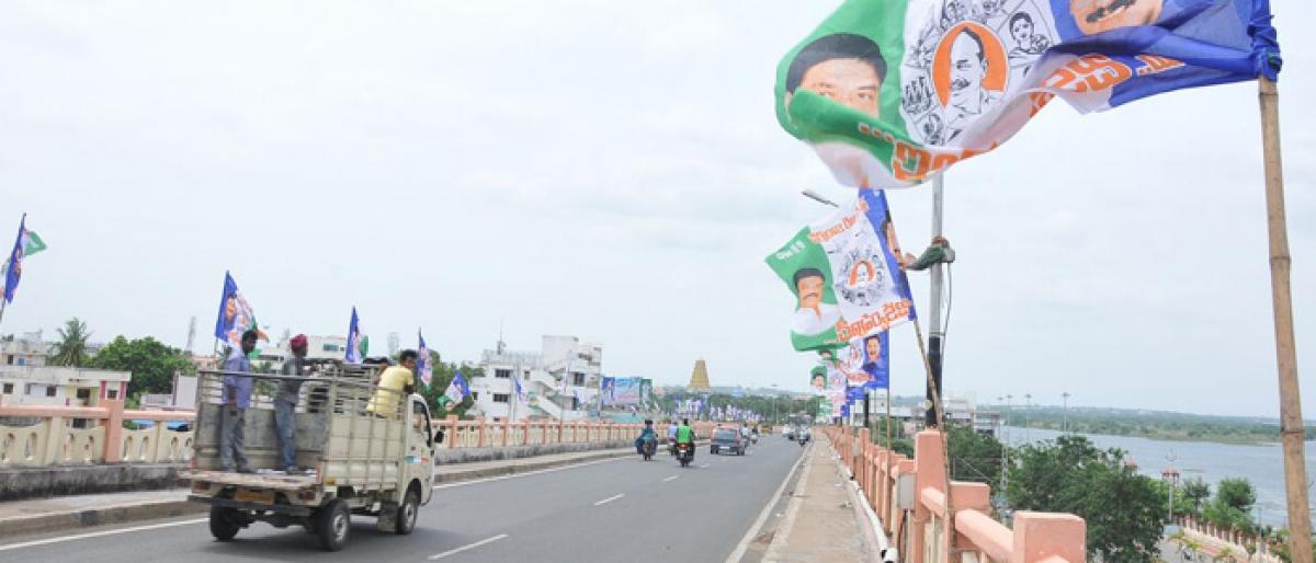  A Road-cum- rail bridge decorated with YSRCP flags in Rajamahendravaram on Monday