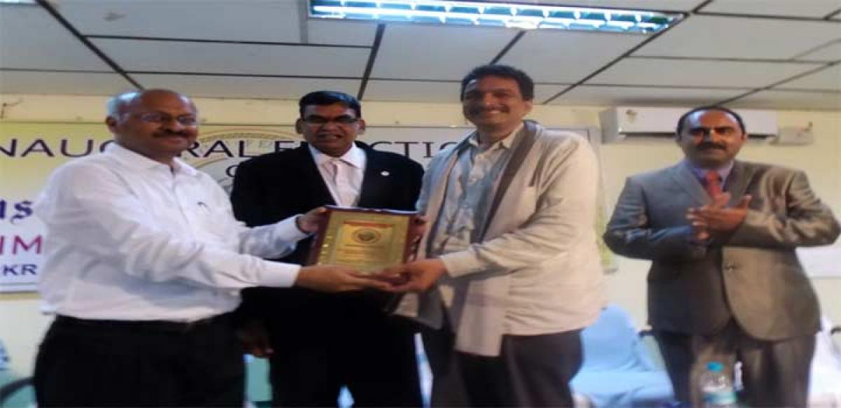 National Chairman Krishnareddy greeting the Bhimvaram centre chairman K Brahmaraju 