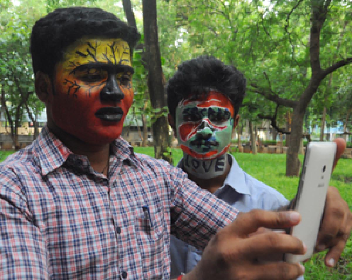 Students participating in a face painting competition on organ donation organised by the Department of Visual Communication at Andhra Loyola College. Photos: Ch Venkata Mastan