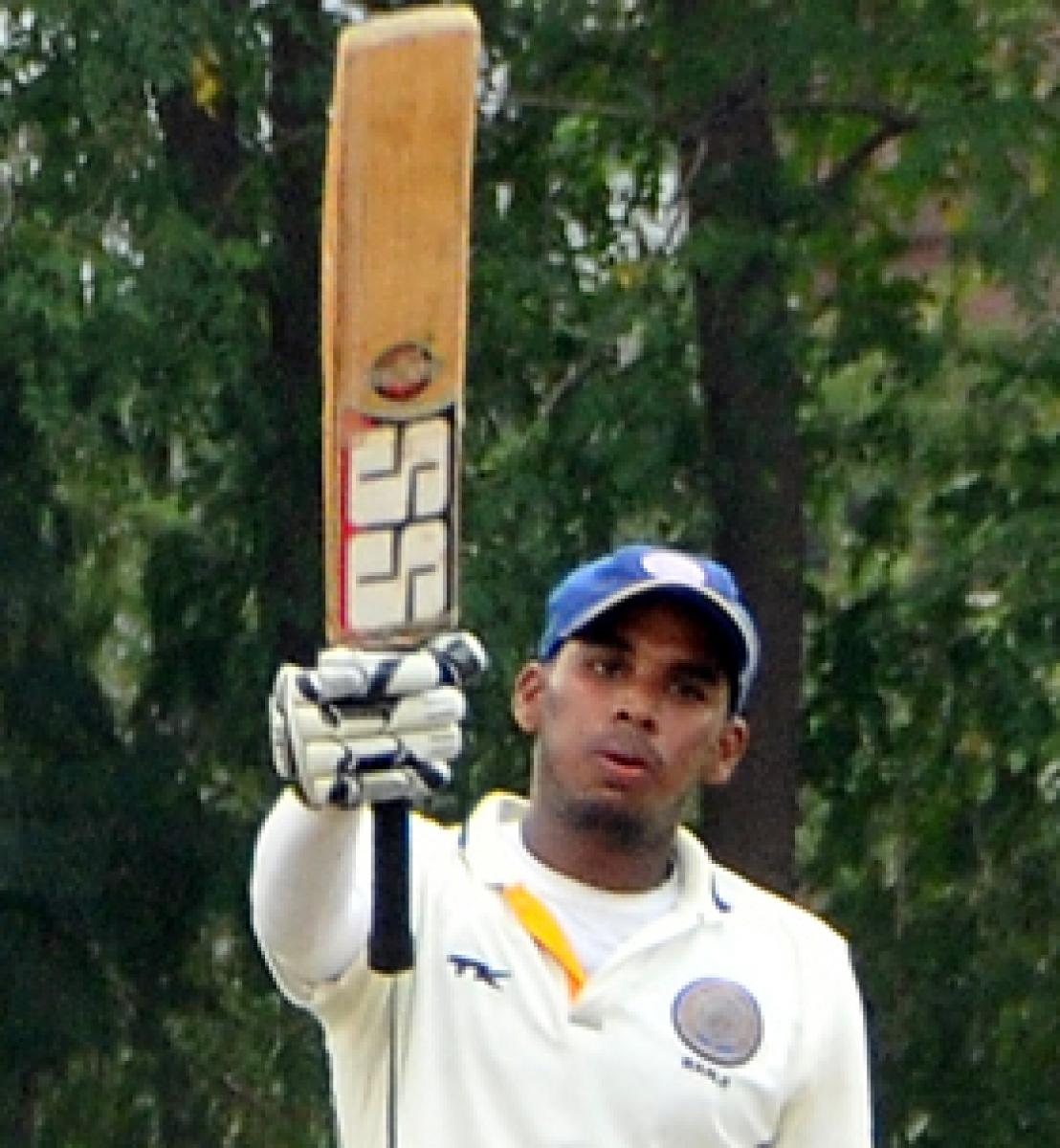Hyderabad XI  opener P Akshat Reddy raises his bat after reaching the three-figure mark against Air India in the All India Coromandel King Moin-ud-Dowlah Gold Cup Invitation cricket tournament in Hyderabad on Friday. Photo: Hrudayanand