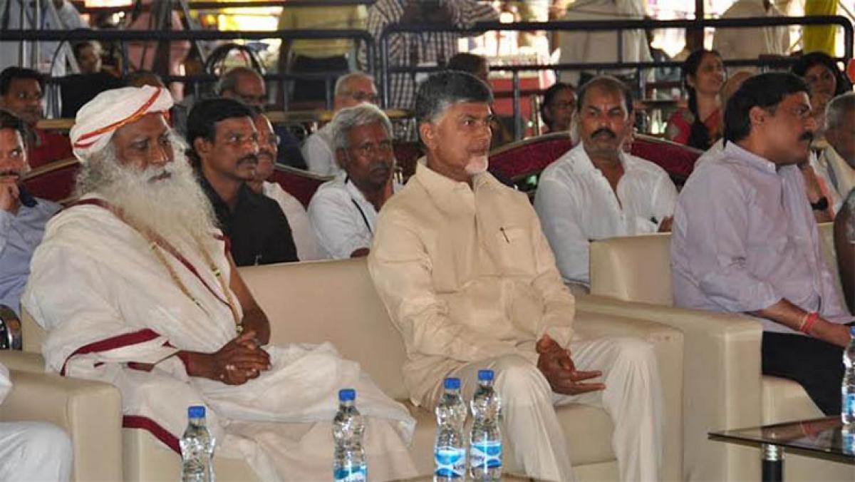 Chief Minister N Chandrababu Naidu and Jaggi Vasudev participating in a programme at Government Arts College grounds in Rajahmundry on Thursday