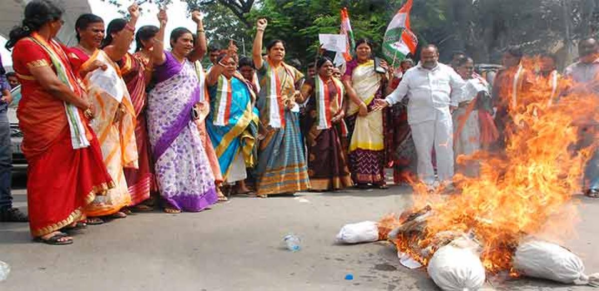 Mahila Congress activists burning an effigy of the Prime Minister in Hyderabad on Saturday