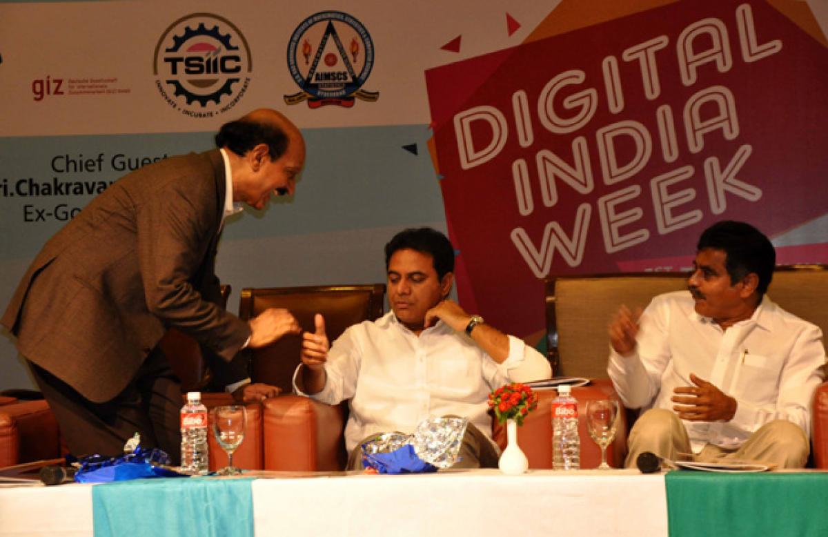 NASSCOM chairman B V R Mohan Reddy having some jovial moments with IT Minister K T Rama Rao at the Swachh Digital Telangana programme at Madhupur in Hyderabad on Monday