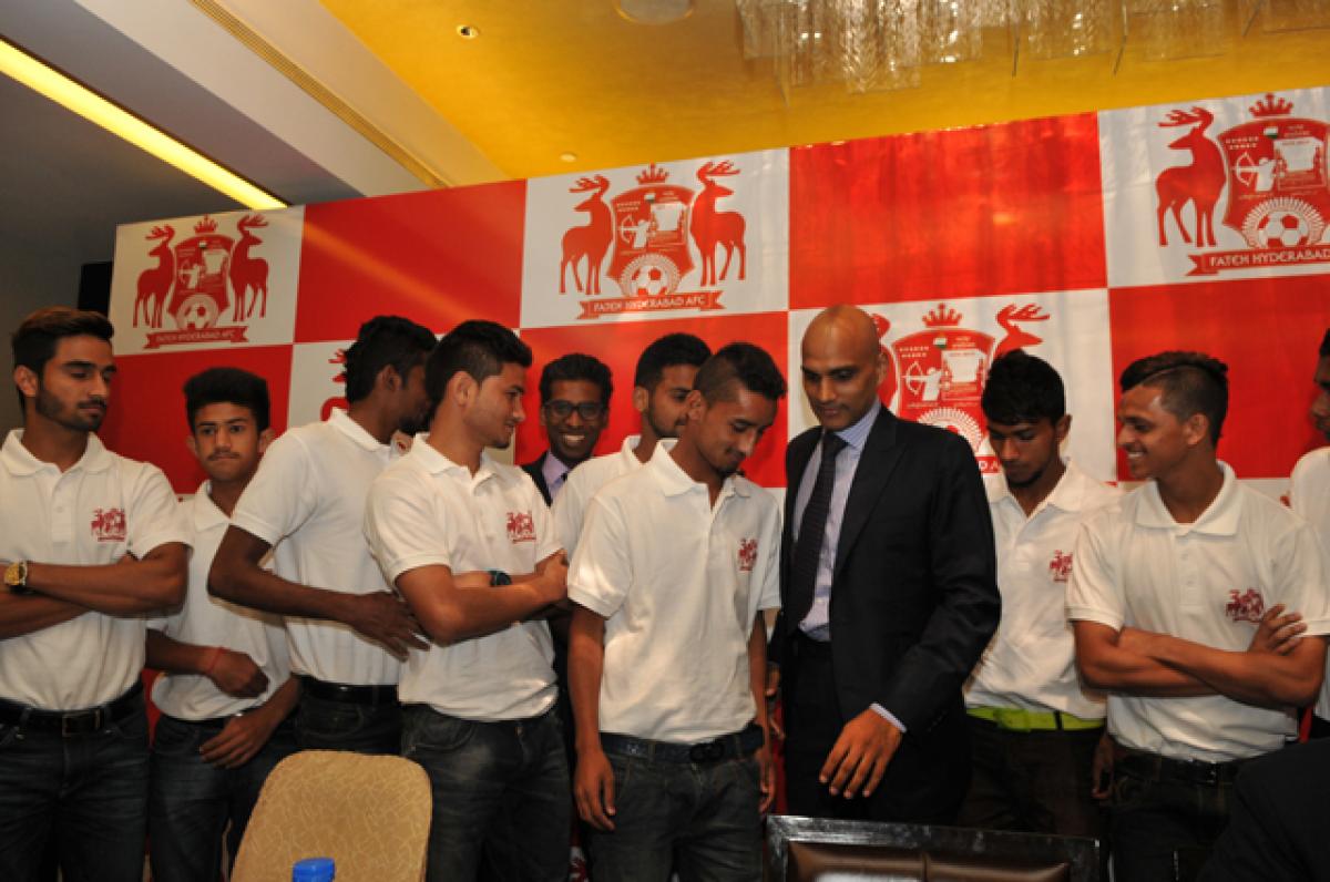  Yogesh Maurya, co-owner of Fateh Hyderabad Associated Football Club (FHAFC) interacts with the team members during the launch programme in Hyderabad on Thursday. Photo: Hrudayanand