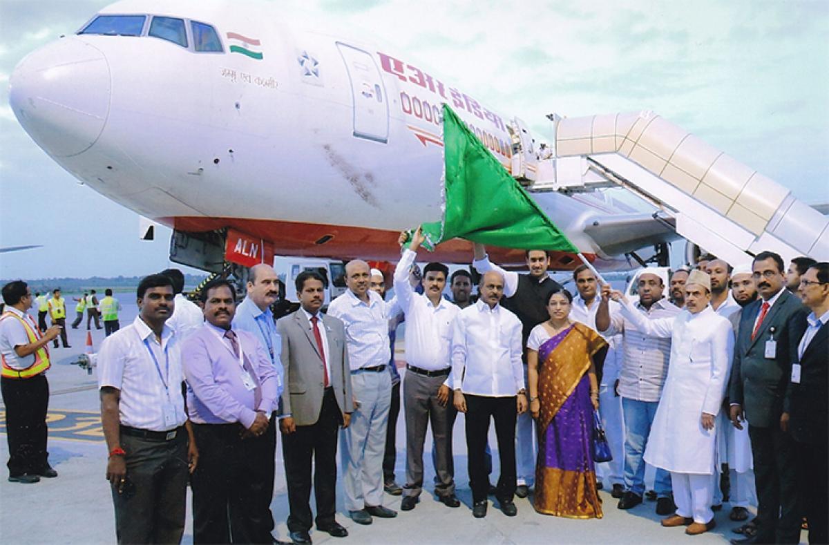 Deputy Chief Minister Mohammed Mahmood Ali flagging off the first Haj flight at the Haj Terminal of the Rajiv Gandhi International Airport in Hyderabad on Wednesday. MLA Aamer Shakeel and Secretary to the government (Minorities Welfare) J D Aruna are also seen 