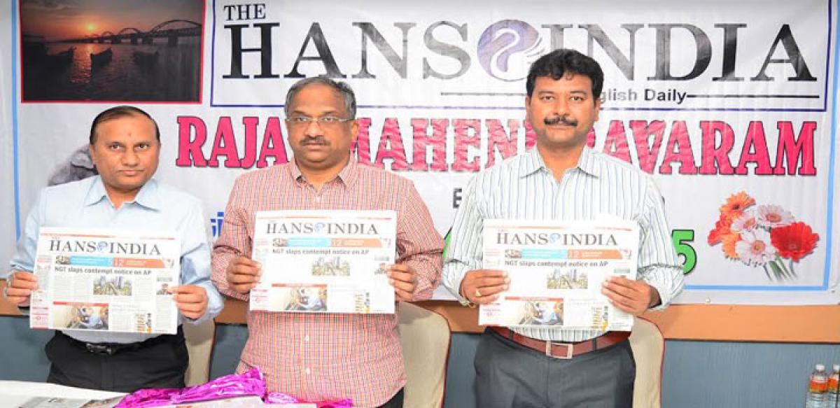 The Hans India Editor Prof K Nageshwar along with Executive Director K Hanumantha Rao (left) and Circulation General Manager B Sai Reddy launching the paper&rsquo;s ninth edition in  Rajamahendravaram on Friday