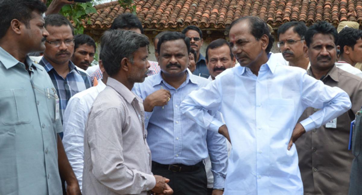 Chief Minister K Chandrashekar Rao interacting with the residents of Yerravalli village as part of the  Grama Jyothi programme in Medak district on Thursday 