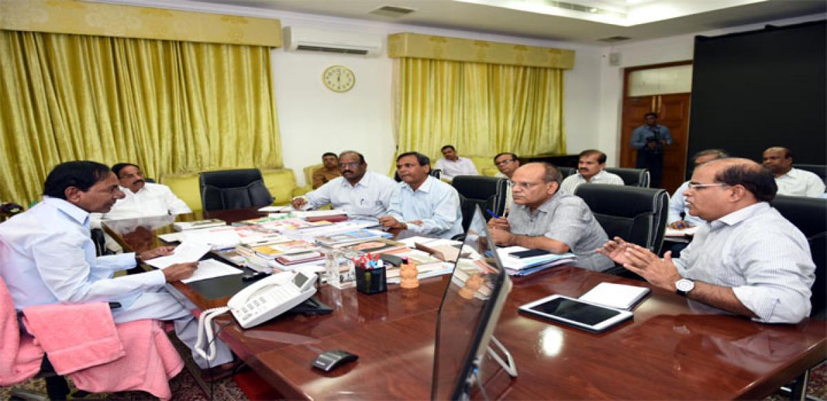Chief Minister K  Chandrashekar Rao interacting with GHMC officials during a review meeting at his Camp Office in Hyderabad on Thursday