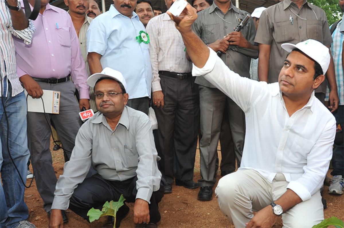 IT Minister KTR taking a selfie after planting a sapling