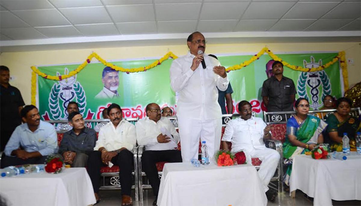 Health Minister Dr Kamineni Srinivas addressing health staff at a meeting in Rajahmundry on Saturday