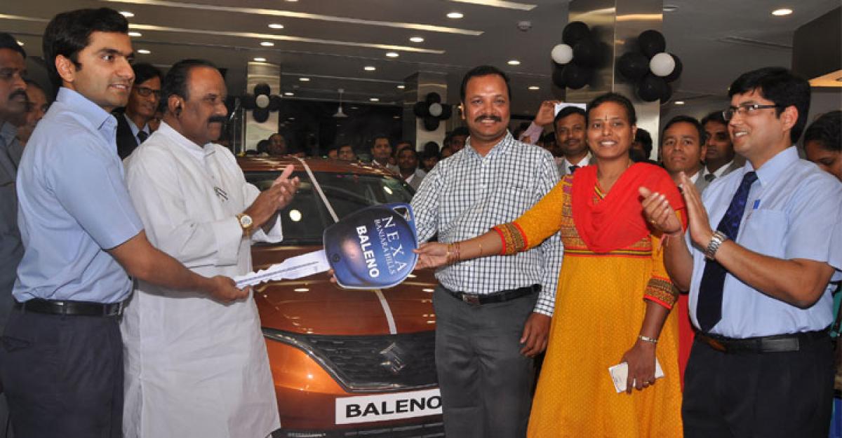 Minister Naini Narsimha Reddy handing over the car keys to P Venkata Subramanyam Gupta at the launch