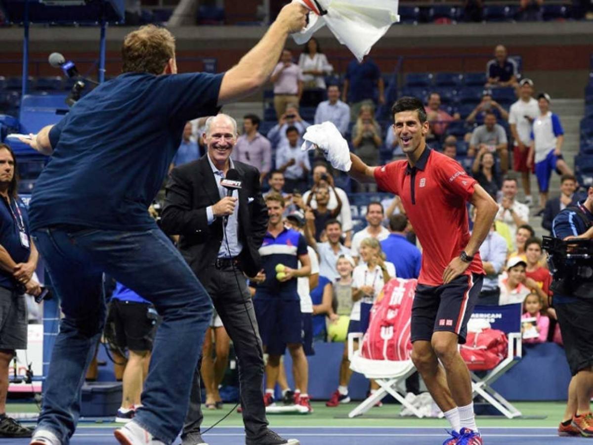World No 1 men player Novak Djokovic shakes a leg in tyopical  'Gangnam’ style with a fan while celebrating his win over Austrian Andreas Haider-Maurer in the US Open men’s singles second round in New York
