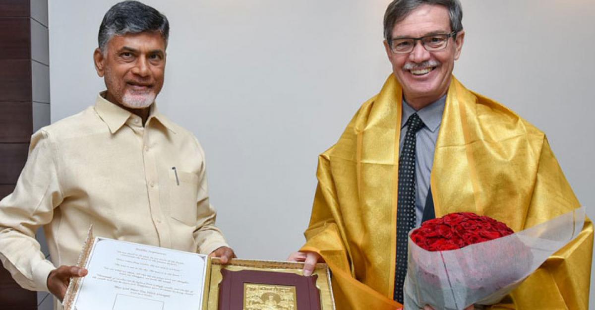Chief Minister N Chandrababu Naidu presents a memento to Australia Minister for Energy, Citizenship and Multicultural Interests, Mike Nahani, during a meeting in Vijayawada on Monday