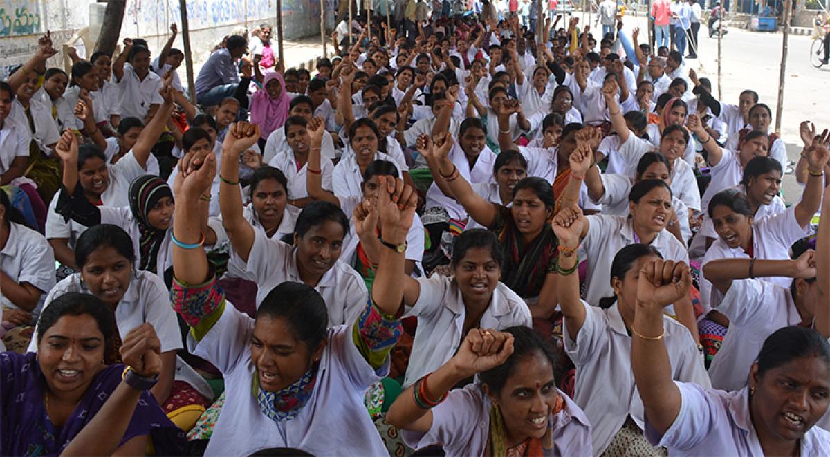Arogyasri employees staging a dharna demanding fulfillment of their demands, at Indira Park  in Hyderabad on Wednesday