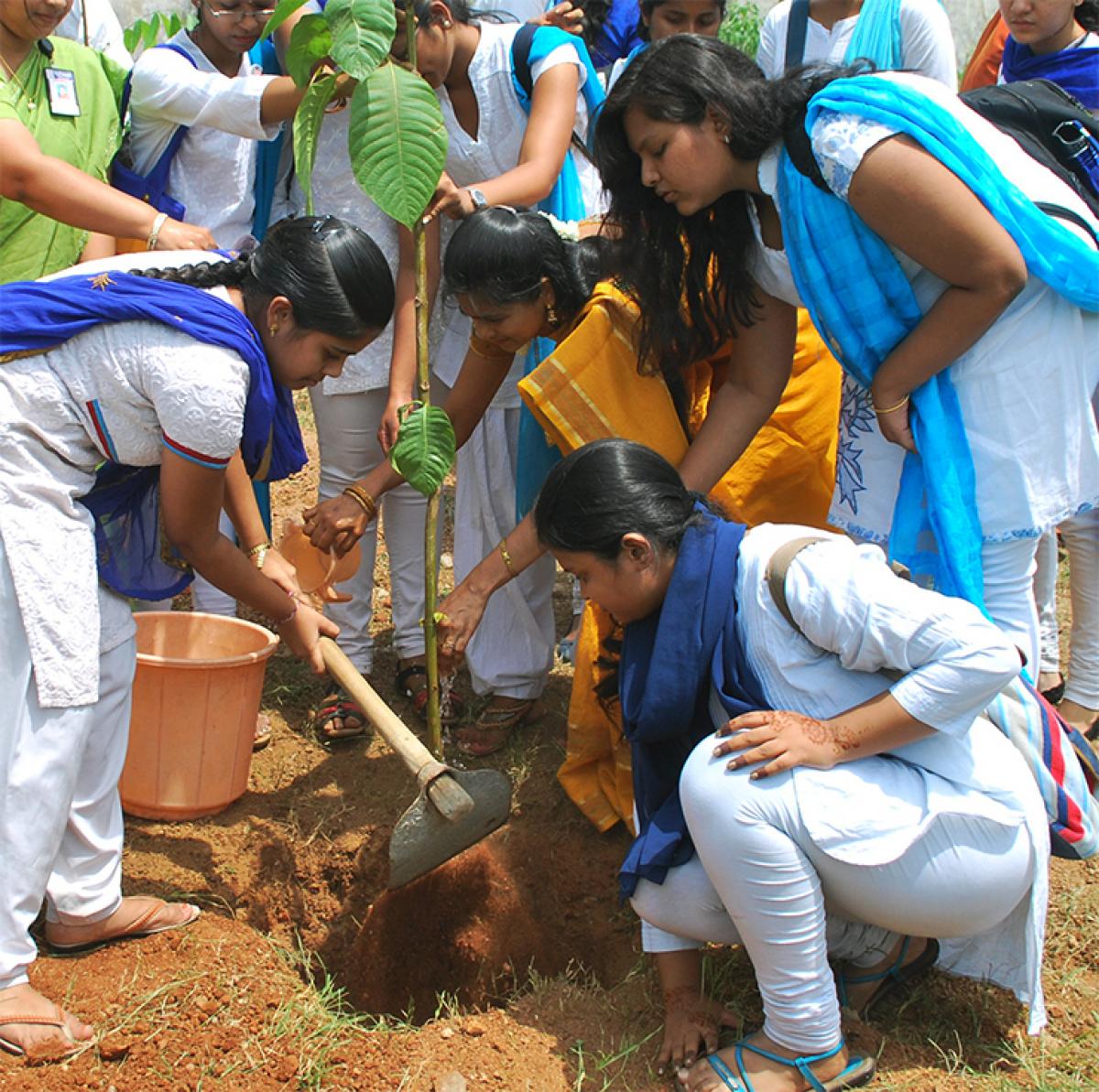 Schoolchildren participating in Haritha Haram in Hyderabad on Friday