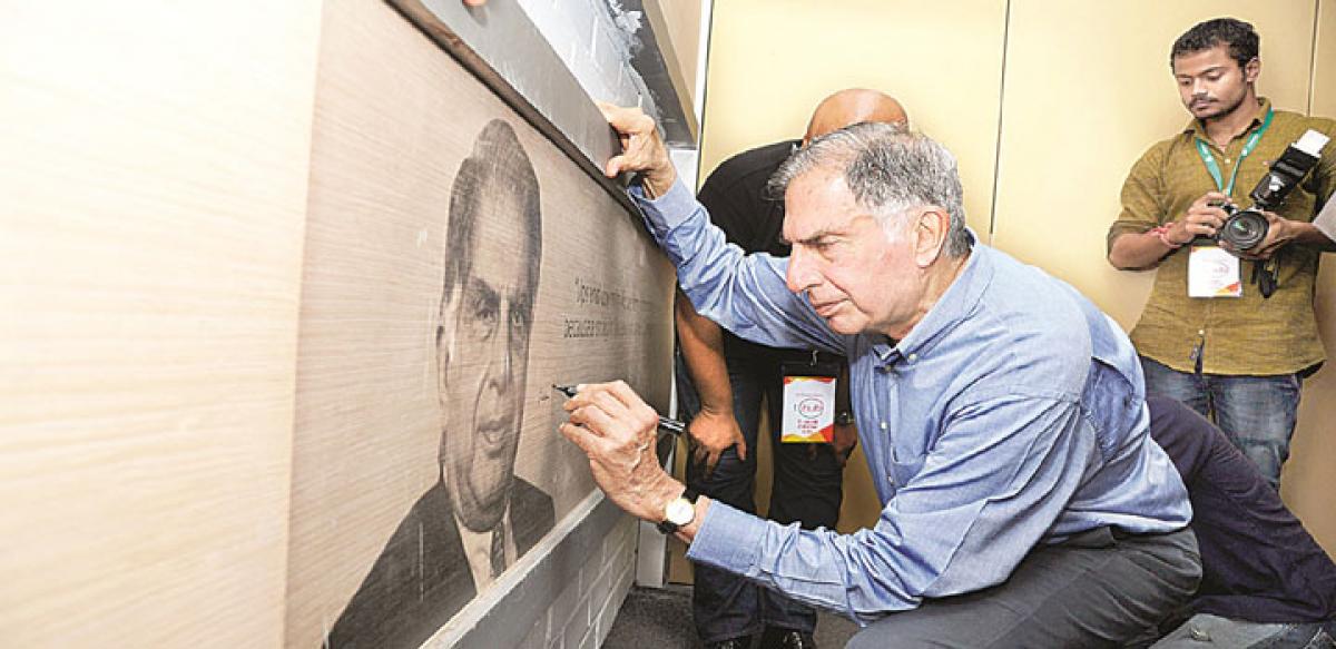 Tata Sons Chairman Emeritus Ratan Tata signing on his portrait at T-Hub before inaugurating the facility in Hyderabad on Thursday 