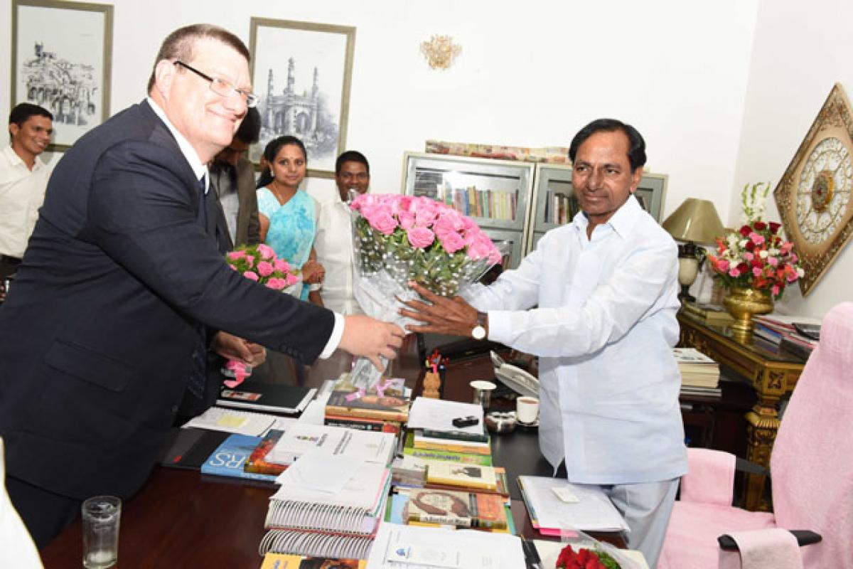 Chief Minister K Chandrashekar Rao receiving Chicago University vice-president David Kanis at his camp office in Hyderabad on Sunday. Nizamabad MP Kavitha and others are also seen 