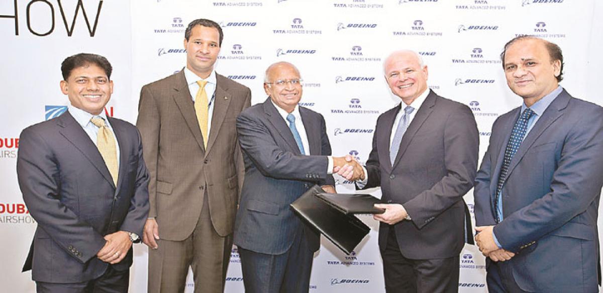 S Ramadorai (left), Chairman, Tata Advanced Systems, and Tom Bell, Senior VP , Boeing Defense exchanging JV agreement at the Dubai Air Show Dubai on Monday. 