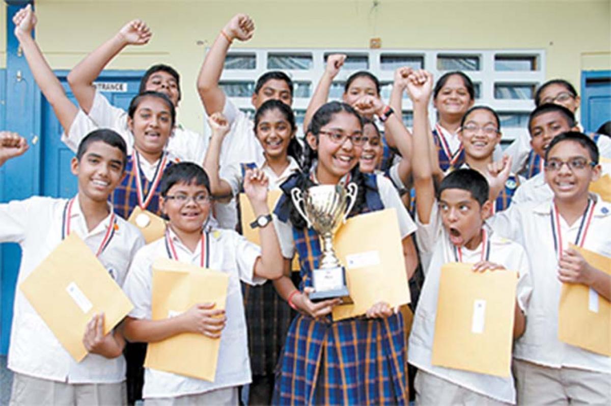 Anusha Saha (centre) of Grant Memorial Primary Presbyterian  School, celebrates with her classmates