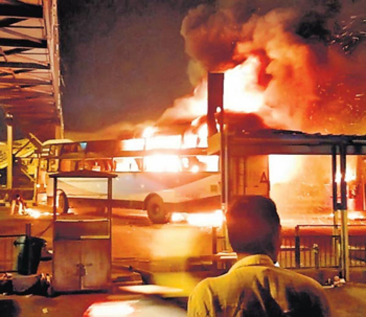A bus goes up in flames as Patidar protests turned violent in Ahmedabad