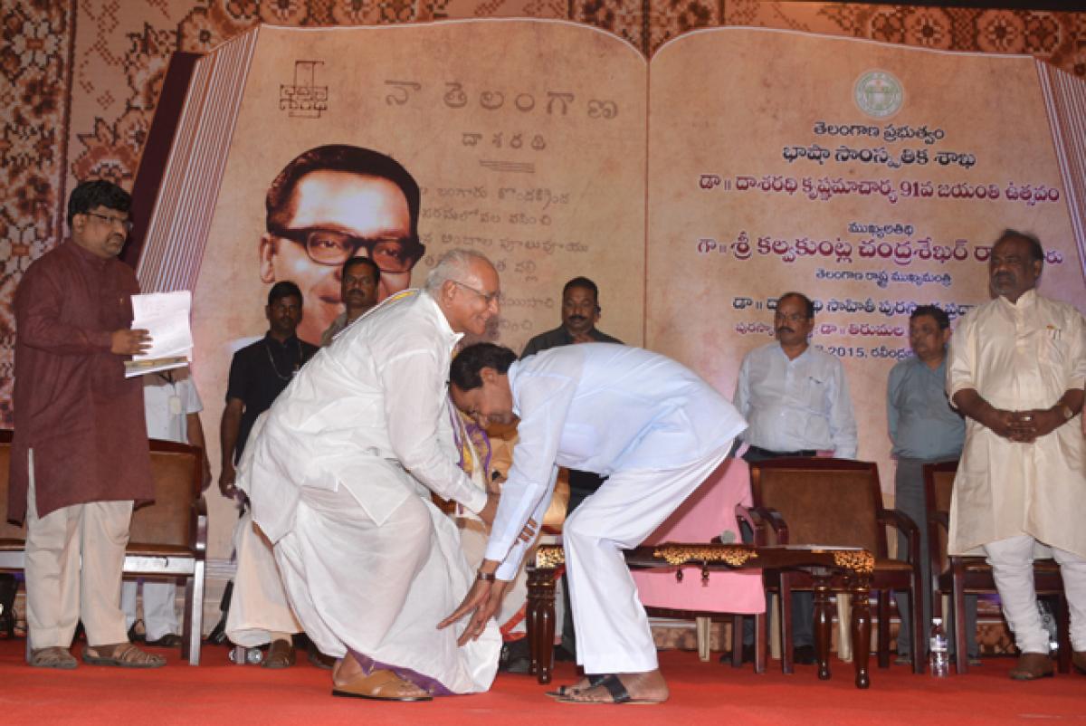 Chief Minister K Chandrashekar Rao seeking blessings from Tirumala Srinivasacharya by touching his feet during noted poet Dasaradi Krishnamachrayulu&rsquo;s 91st birth anniversary celebrations in Hyderabad on Wednesday. 