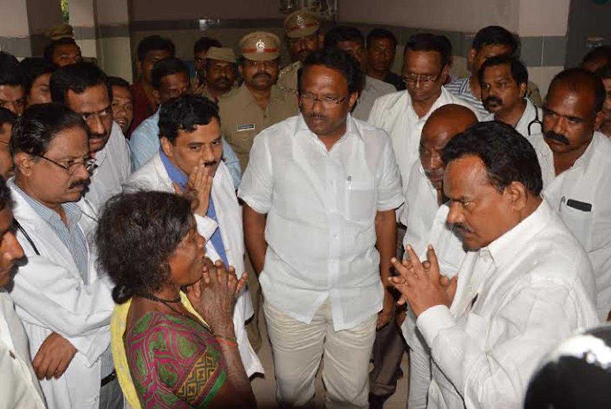 Minister for Health C Lakshma Reddy interacting with patients at RIMS Hospital in Adilabad on Sunday