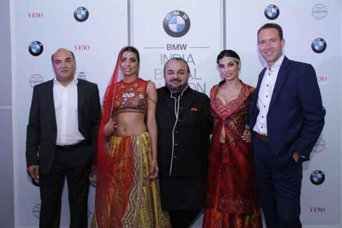 (From left) Gautham Gudigopuram, Managing Director of KUN Exclusive, JJ Valaya with models and Frank Schloeder, Director Marketing BMW India