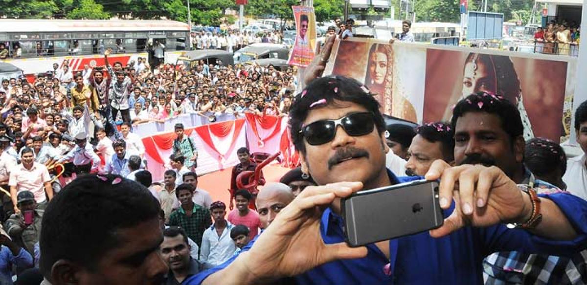 Nagarjuna taking a selfie at the launch of 7 star celebrations at Kalyan Jewellers 