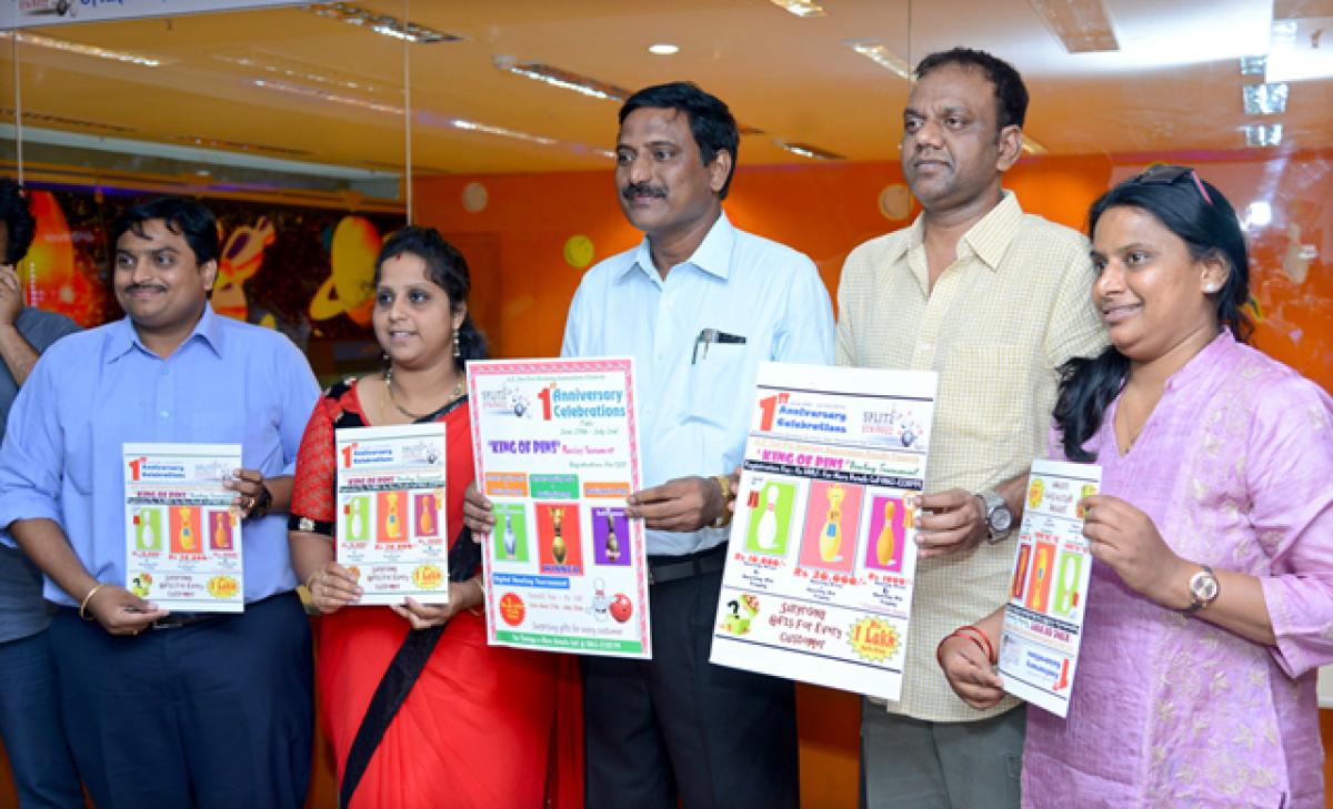 Officials unveiling the bowling championship poster