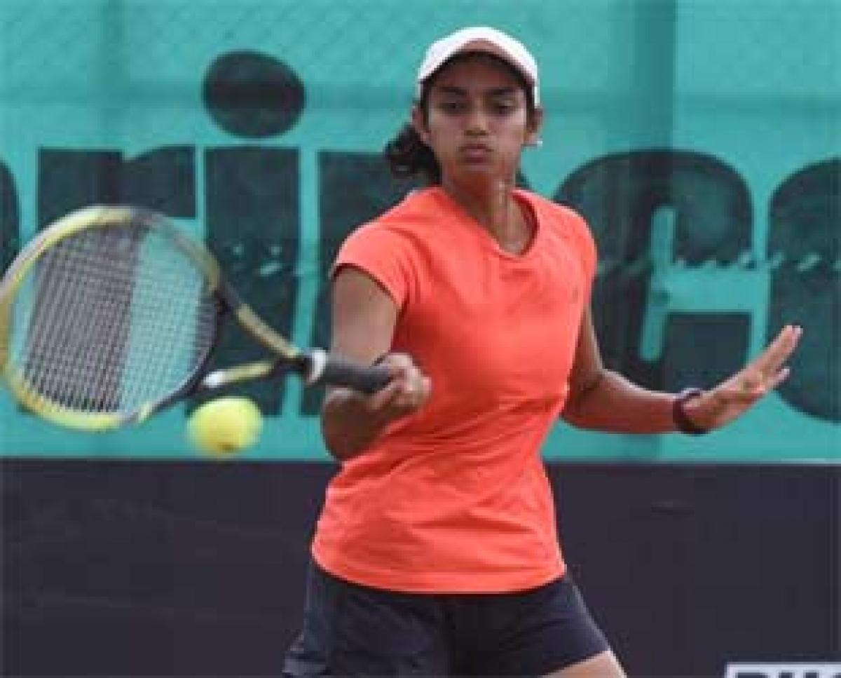 Rishika Sunkara  plays a forehand shot against Shivani Manjanna in the second round of the Phoenix Live ITF $10,000 women championship in Hyderabad on Friday. Photo: Saleem 