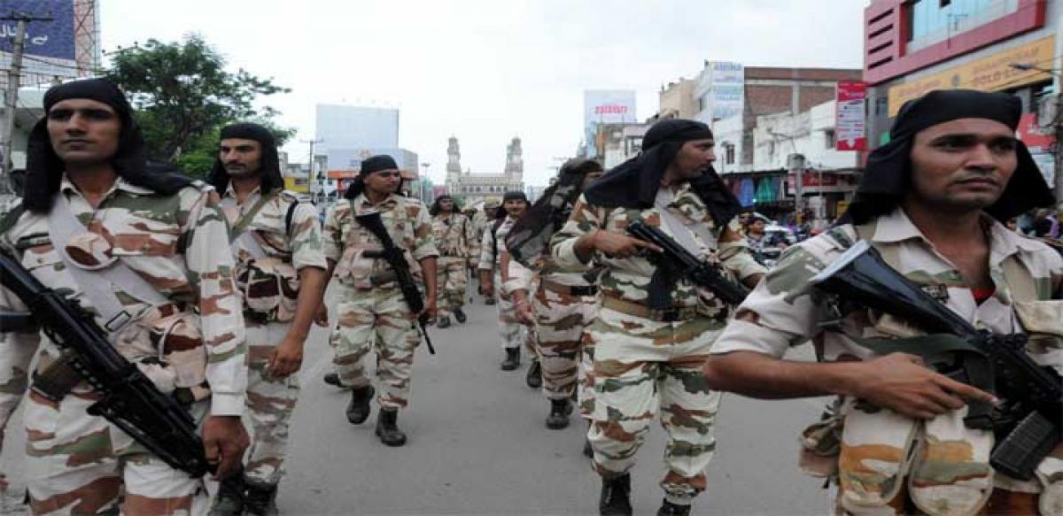 Police personnel holding a flag march as part of security for Ganesh Chaturthi and Bakrid festivals at Charminar in Hyderabad on Friday Photo: Mir Zulfequar Ali