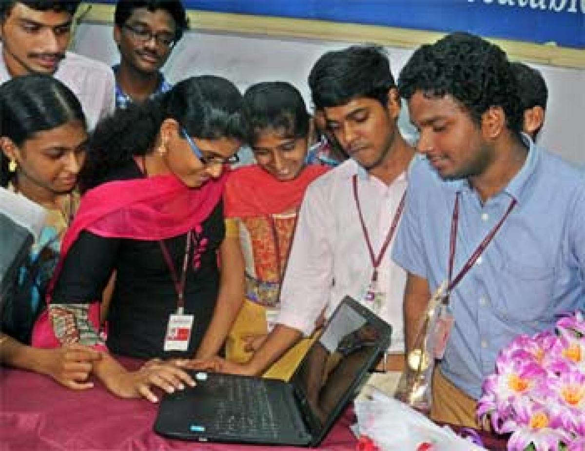 Students of Nalanda Degree College looking at the newly developed tourism website