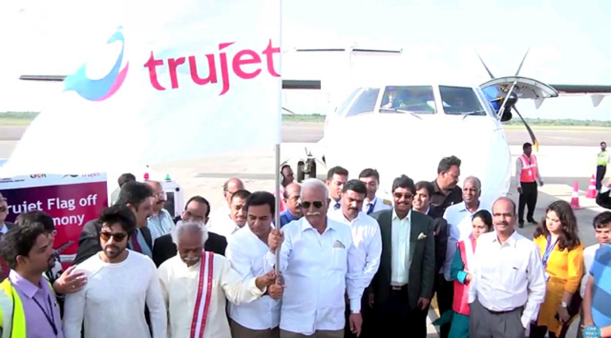 Union Aviation Minister P Ashok Gajapathi Raju flagging off Trujet flight operations while Union Minister of State for Labour Bandaru Dattatreya, TS IT Minister K T Rama Rao and promoter actor Ram Charan Tej look on, at Rajiv Gandhi International Airport at Hyderabad on Sunday
