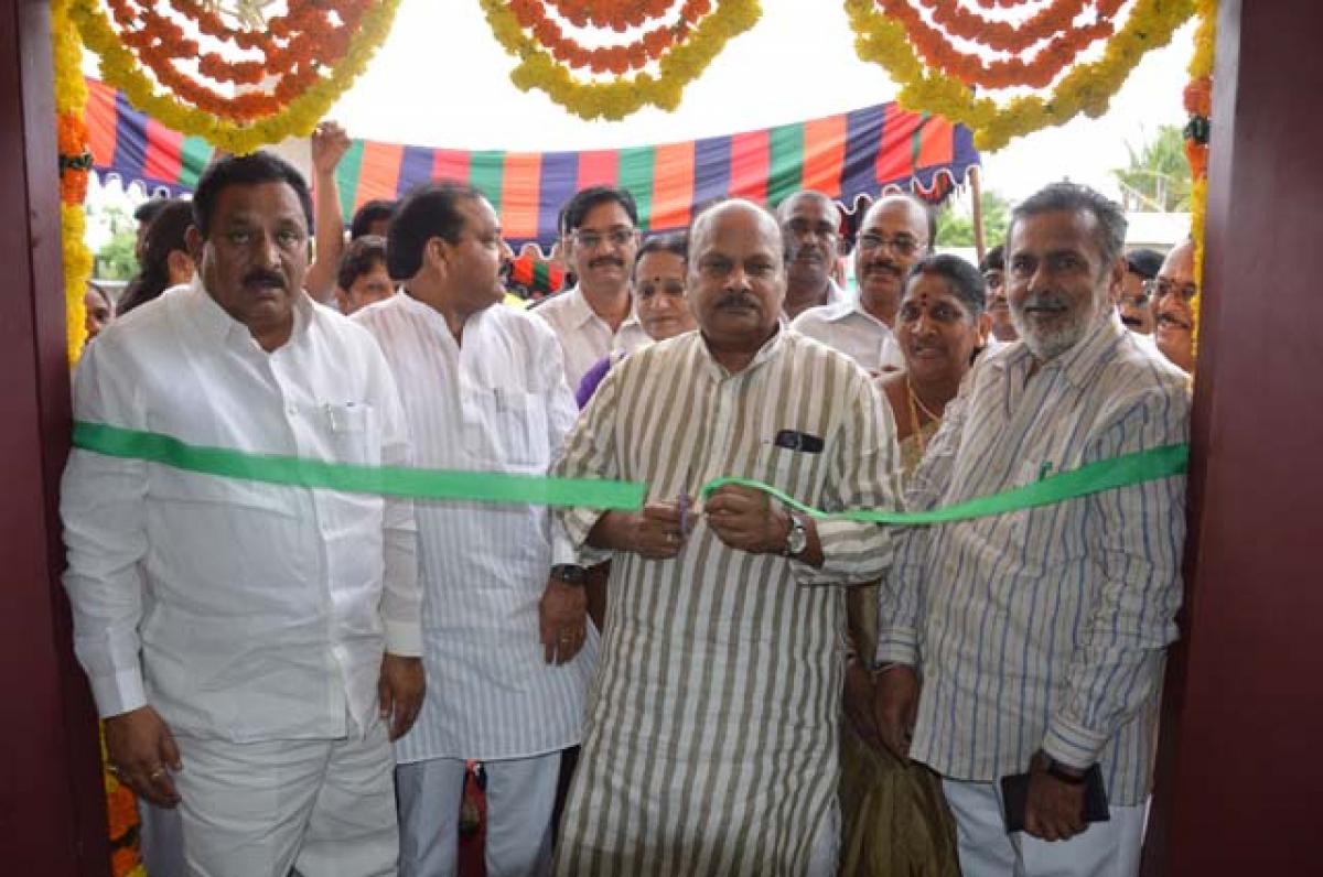  Finance Minister Yanamala Ramakrishnudu opening PHC building at Velangi in Karapa mandal of East Godavari on Sunday. 
