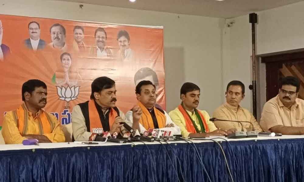 BJP MP G V L Narasimha Rao addressing media in Tirupati on Wednesday. BJP national spokesperson Dr Sambit Patra and other leaders are also seen