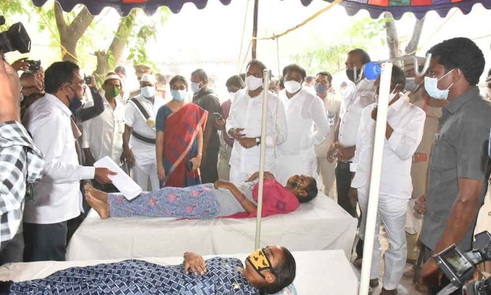 Minister for Health Alla Nani along with Labour Minister Gummanur Jayaram, District Collector G Veera Pandiyan and MLAs enquiring about the health condition of diarrhoea affected people at Arun Jyothi Nagar in Adoni on Friday