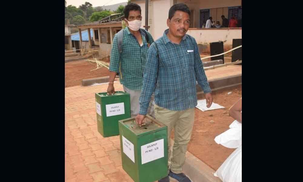 Staff carrying poll material in Visakhapatnam on Wednesday