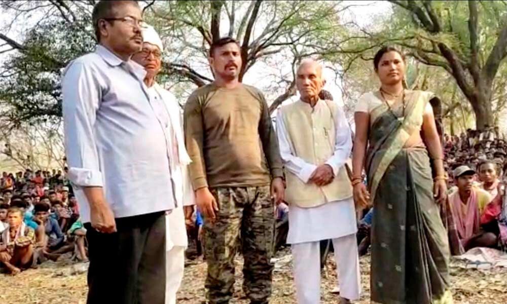 CoBRA commando Rakeshwar Singh Manhas with social activists while being released by Naxals at a Maoist hideout, in Bijapur district of Chhattisgarh on Thursday