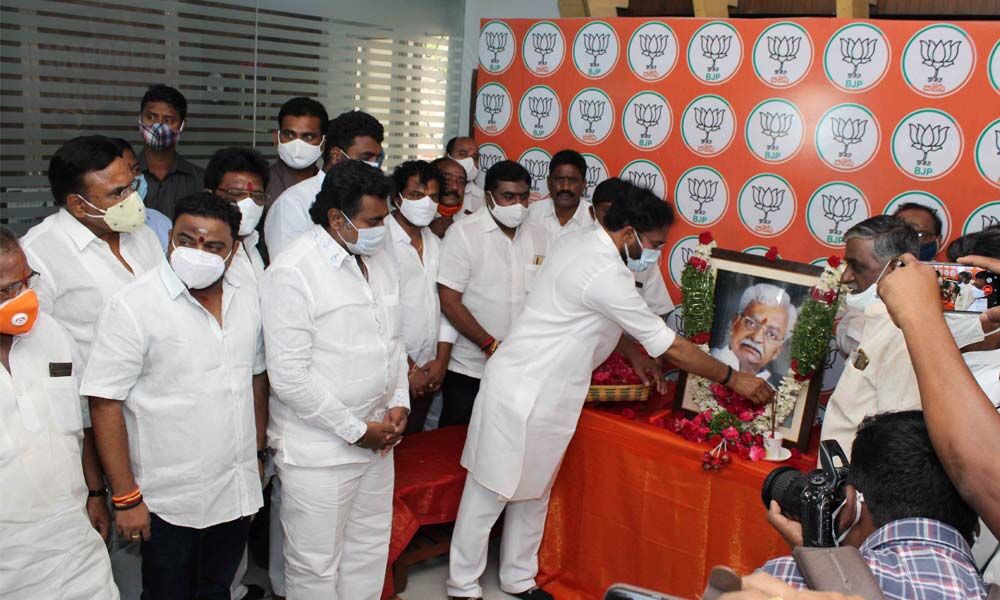On the death anniversary of BJP leader Ale Narendra, G Kishan Reddy, the Union Minister of State for Home Affairs,Ale Bhaskar Raaj, the BJP OBC Morchastate president, and others paying floral tributes at Dr Shyam Prasad Mukherji Bhavan at Nampally on Friday