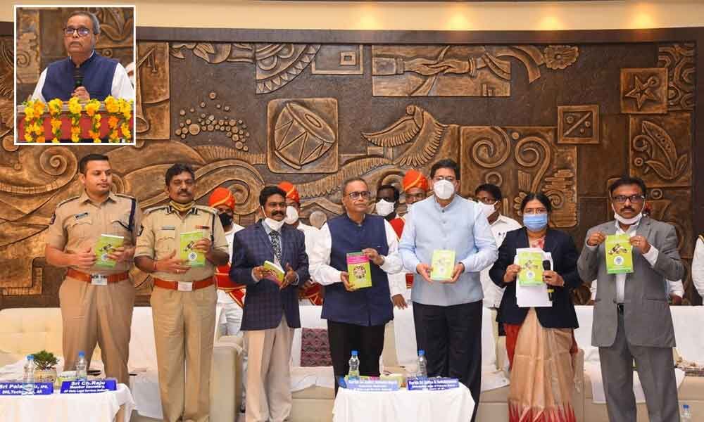 Executive chairman of the State Legal Services Authority, Justice Joymalya Bagchi speaking at a programme on NALSA schemes for women and children in Ongole on Monday; Justice Joymalya Bagchi, Justice MV Ramana, Collector P Bhaskara, district judge PV Jyothirmai, SP Siddharth Kaushal and others releasing a book on NALSA services in Ongole on Monday