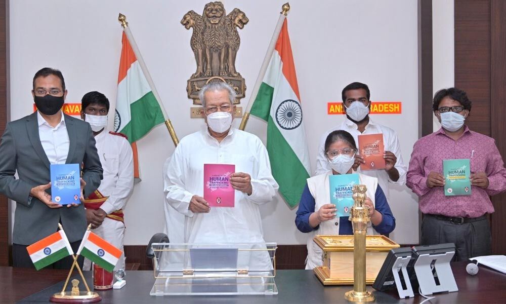 Governor Biswa Bhusan Harinchandan, along with founder of NGO Prajwala, Sunitha Krishnan, and others releases handbooks on dealing with human trafficking, at Raj Bhavan in Vijayawada on Thursday
