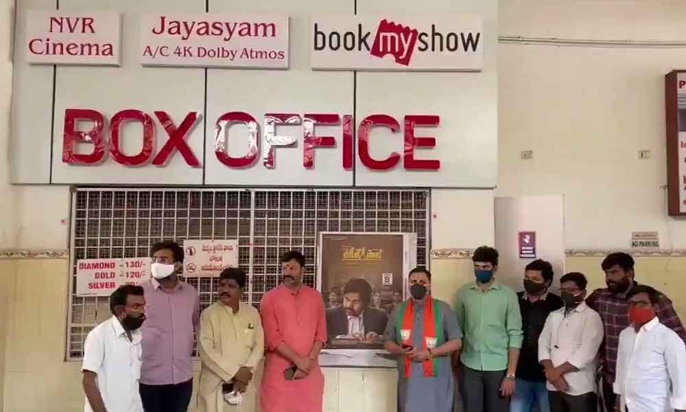 BJP leaders wait for tickets at a film theatre where Pawan Kalyan’s movie was released in Tirupati on Friday