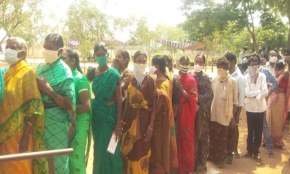 Voters bracing the scorching sun in queue line waiting for the use of their vote at Hanumanthuni Padu of Prakasam district on Thursday