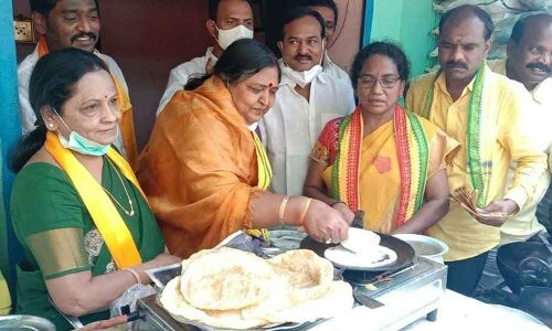 TDP MP candidate Panabhaka Lakshmi making dosas during election campaign at Sundharaiah Nagar in Tirupati on Wednesday