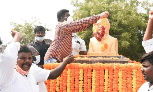 District Collector G Veera Pandiyan garlanding the statue of Dr Babu Jagjivan Ram on the occasion of his 114th birth anniversary in Kurnool on Monday